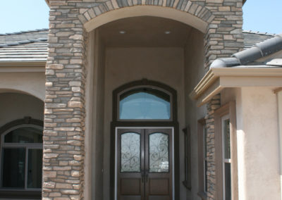 Stone covered walkway leading to front door