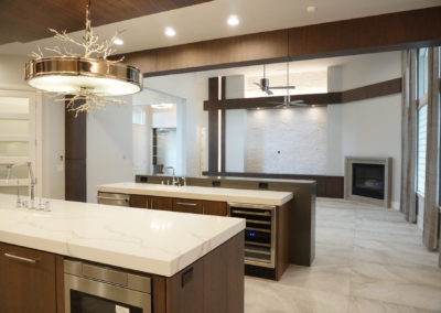 Kitchen with multiple islands facing family room