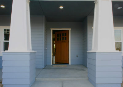 Blue house with open brown door