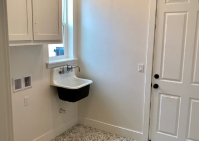 Custom laundry room with sink