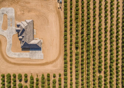 Arial view of newly constructed home on dirt lot