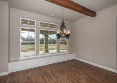 Dining area with windows and exposed beam