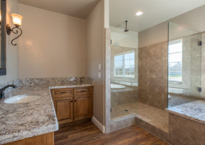 Bathroom showing sink and glass shower