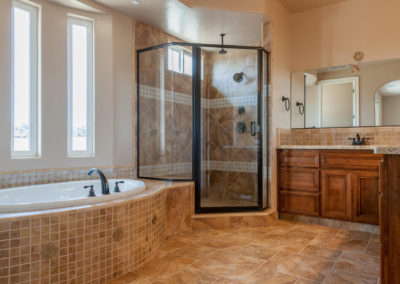 Bathroom with soaking tub and glass shower