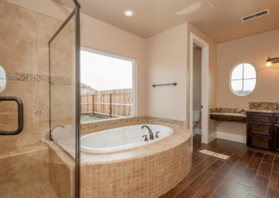 Bathroom with soaking tub and glass shower new construction