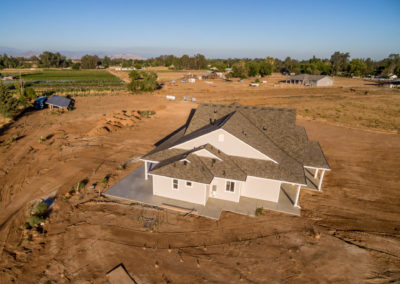 Large newly constructed home on dirt lot