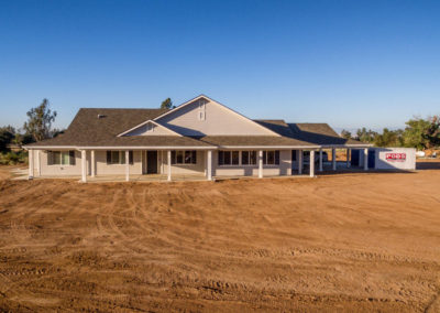 Large newly constructed home on dirt lot