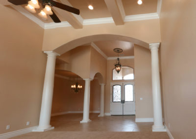 Facing from entryway from the inside with recessed lighting and ceiling fan