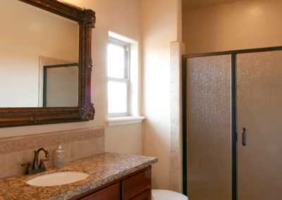Bathroom showing glass shower and single sink