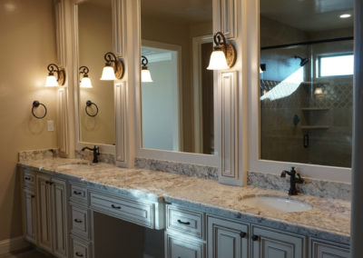 Bathroom vanity with double sinks and triple mirrors