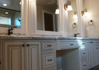 Bathroom vanity with double sinks and triple mirrors