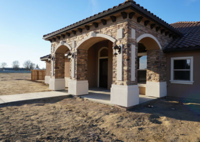 Front of newly constructed California home on dirt lot