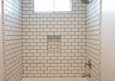 Bathroom shower with subway tile