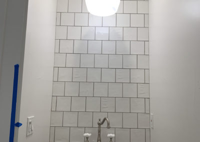 Bathroom sink with hanging light fixture over it