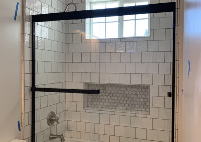 Glass shower doors with black accents