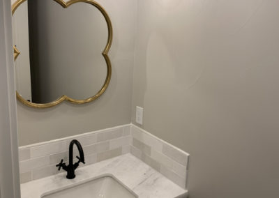 Bathroom sink with mirror and light fixtures
