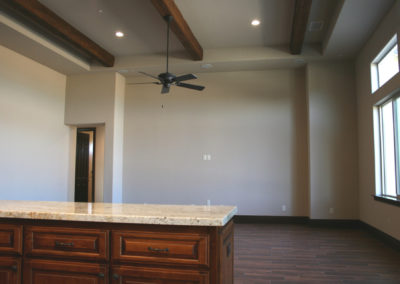 Room with tan walls and ceiling fan