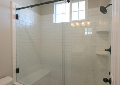Shower with built in seat and glass door