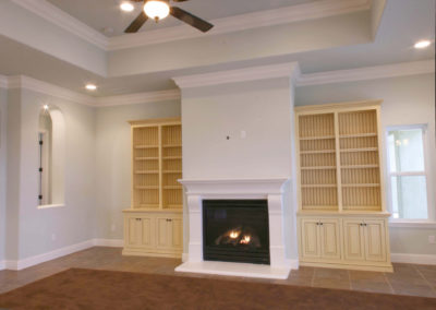 Large white fireplace in living area
