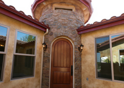 Curved stone entry way of home