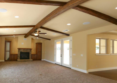 Living area with exposed beams and fireplace