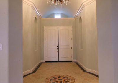 Entryway with chandelier and inlay floors