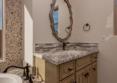 Bathroom sink with mirror and granite