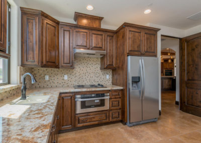 Kitchen with granite counter and custom cabinets