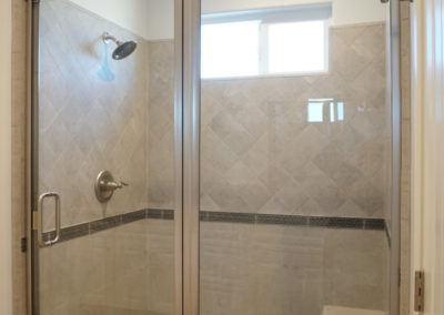 Sone tiled shower with built in bench