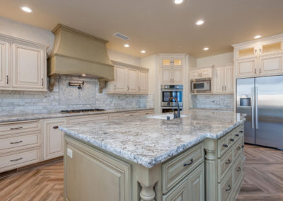 cream kitchen with stone and island