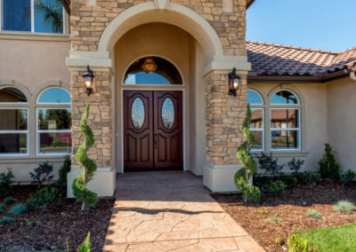 Outside of home with arched entry way
