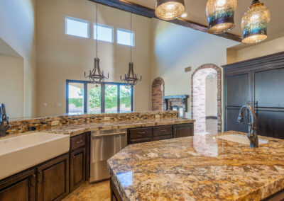 Marble kitchen with farmers sick and light fixtures